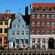 Danish Renaissance style apartment buildings with quaint shops and outdoor cafés line a waterfront